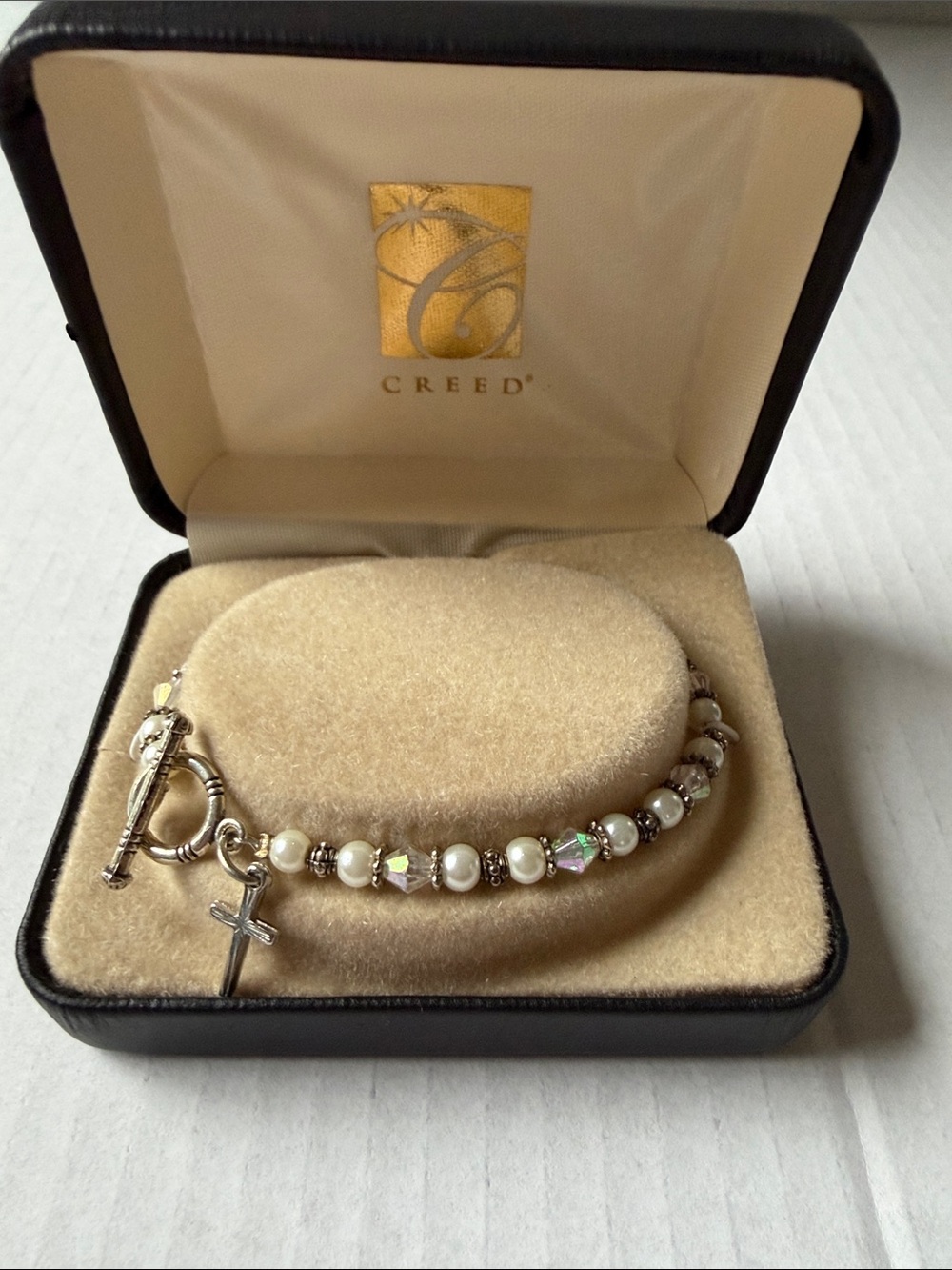 Creed Silver and White Pearl Bracelet with Cross Charm and Iridescent Beads